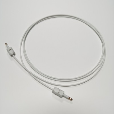 White optical audio cable with connectors, coiled neatly on a plain background