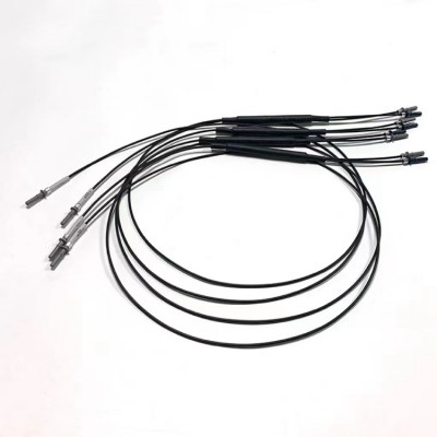 HFBR-4501 1x2 fiber splitter: coiled black cables with neatly aligned metal connectors (industrial-grade).